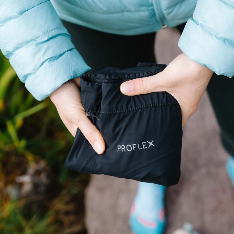 women holding folded pants