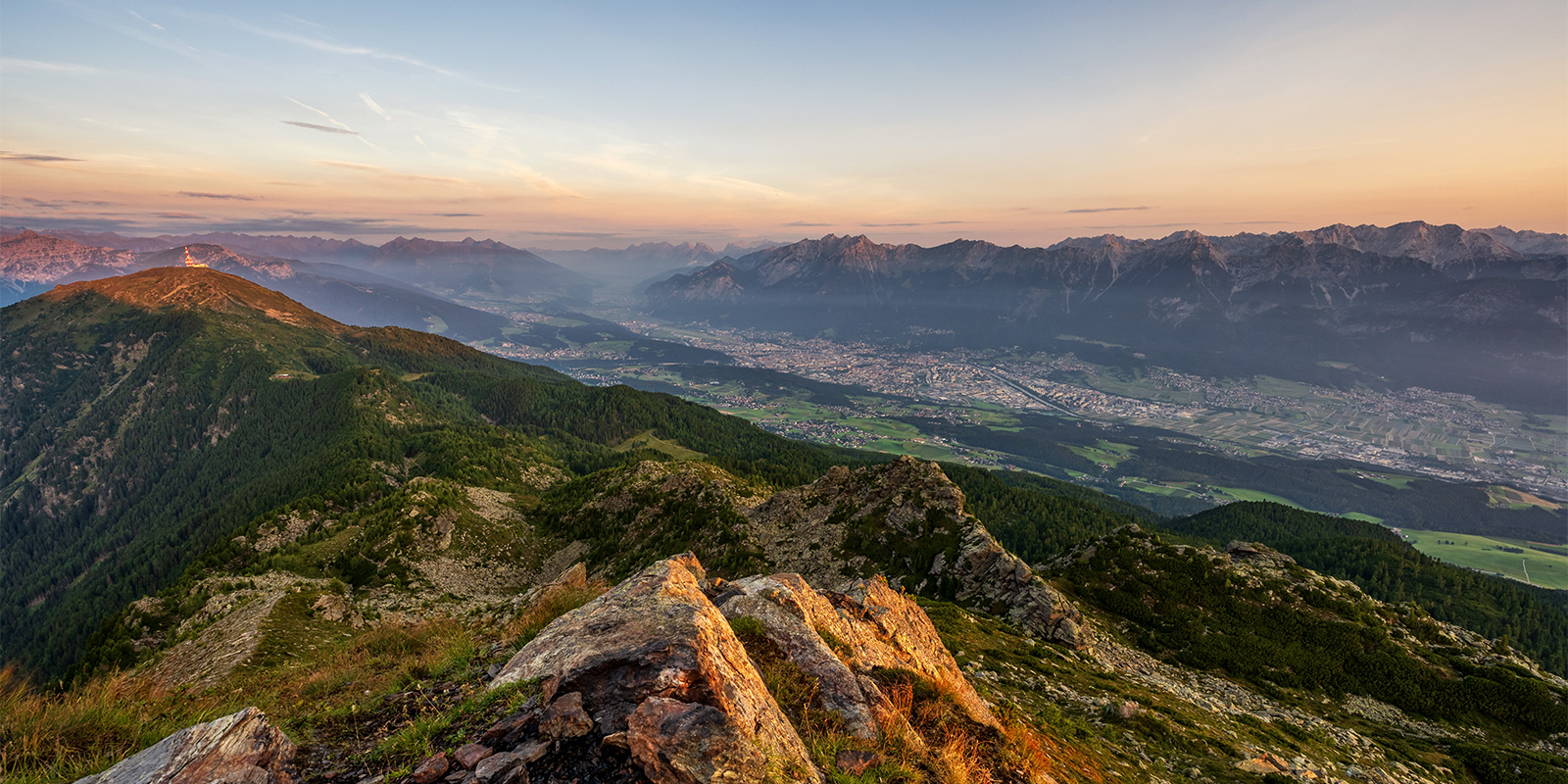 sunrise in Austrian Alps with panoramic view of mountain valley