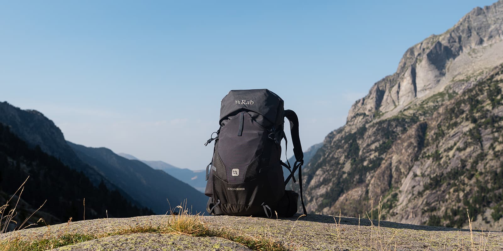 product shot of the RAB Exxon 35 ND women's backpack with mountains in background